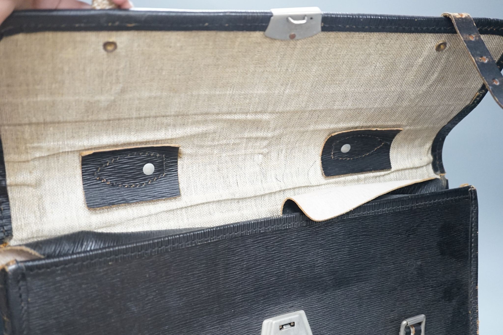 Three black leather civil service attache cases with ERII monogram